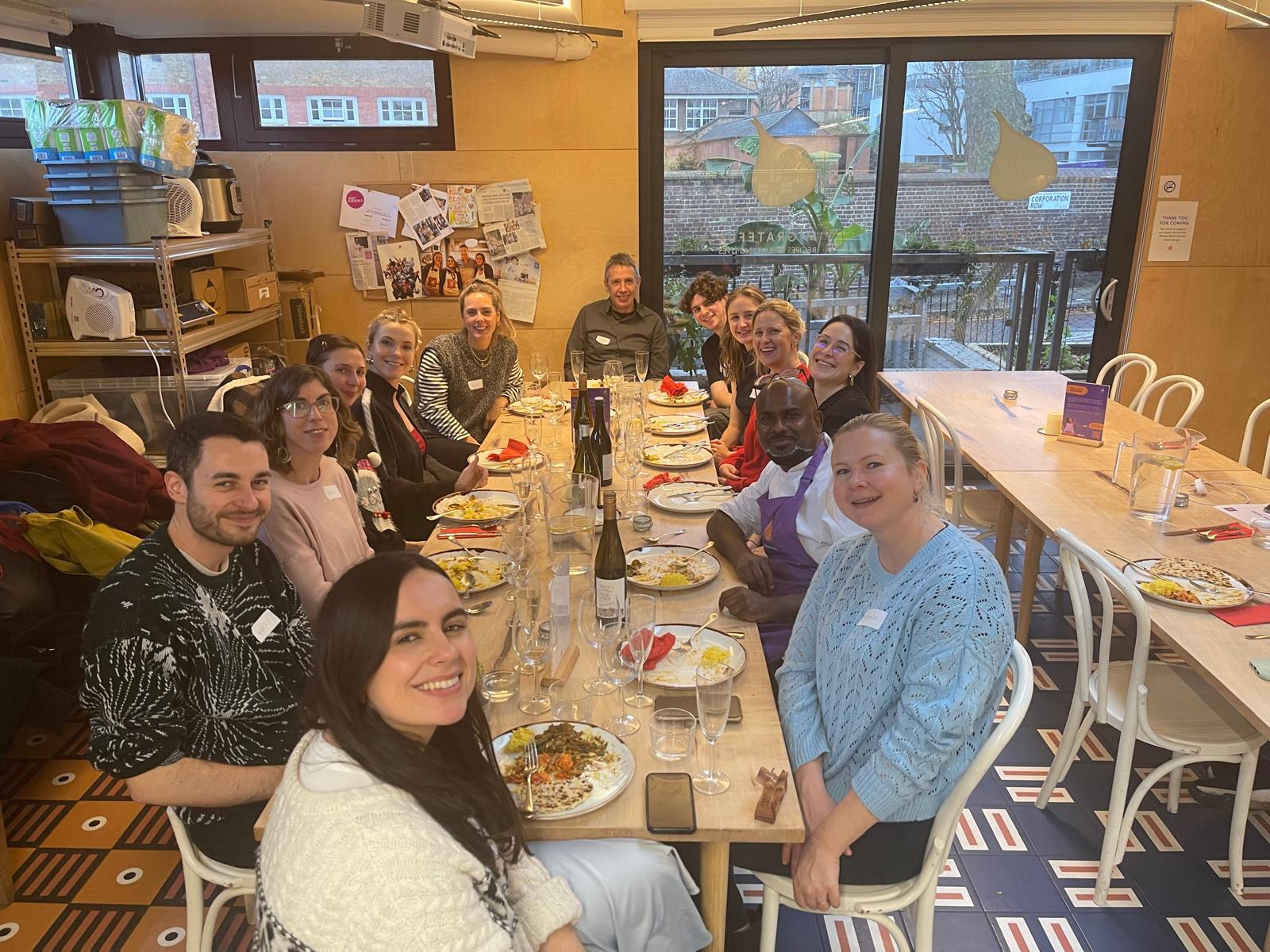 Supper club guests sharing food